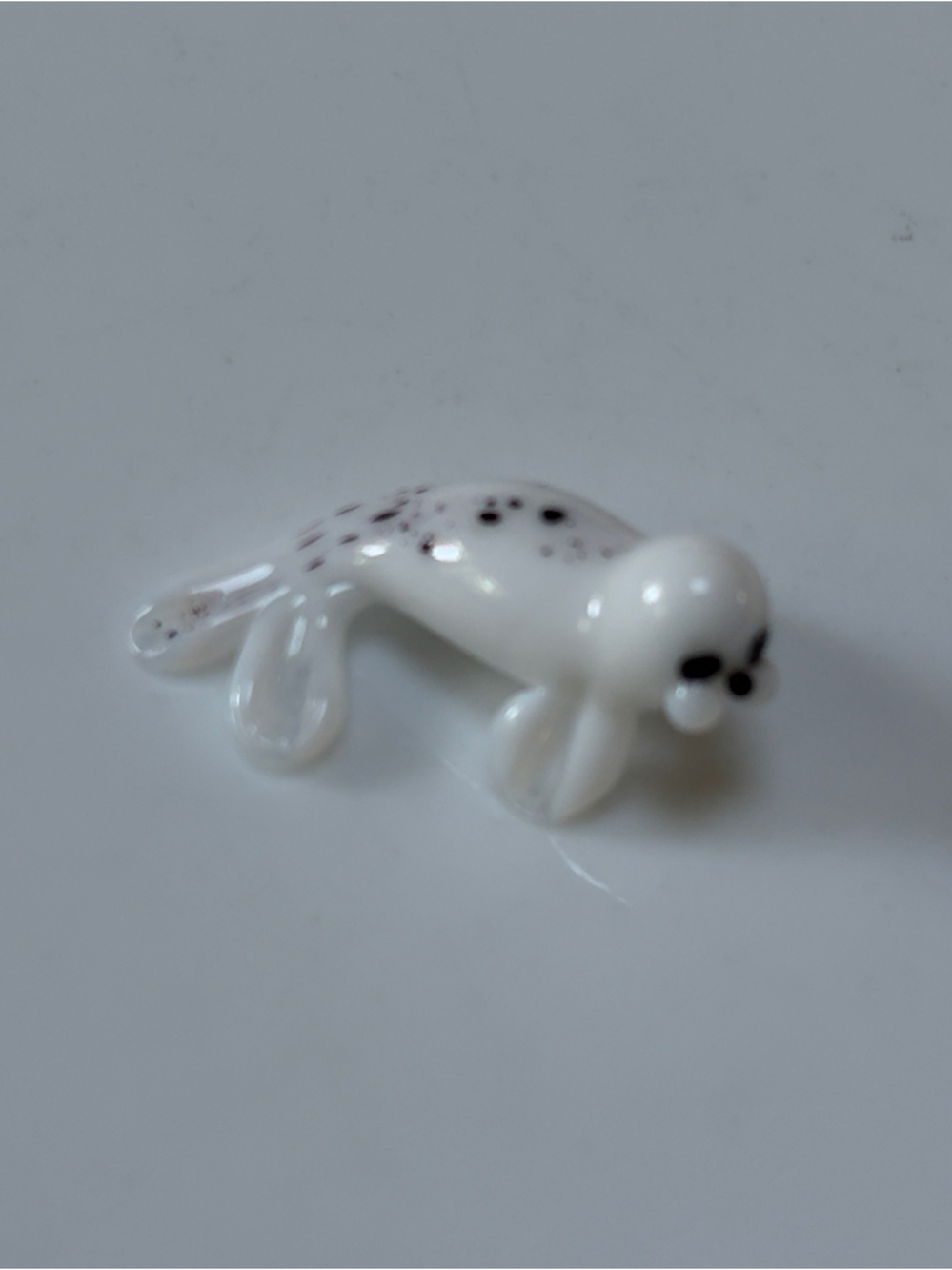 White Glass Seal Miniature Figurine with Black Spots